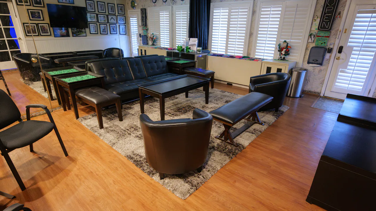 Parent waiting area with couches, chairs, and a coffee table
